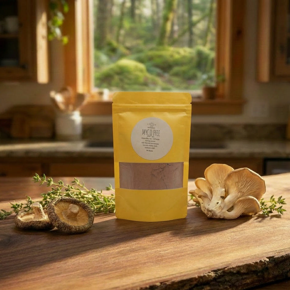 Yellow package with a label on a wooden surface, surrounded by mushrooms and herbs, with a window view of greenery in the background.